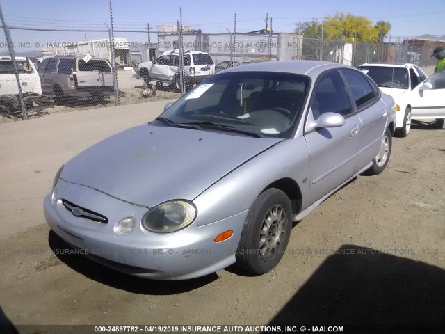 1FAFP53S9XG293629 - 1999 FORD TAURUS SE/COMFORT/SPORT SILVER photo 2