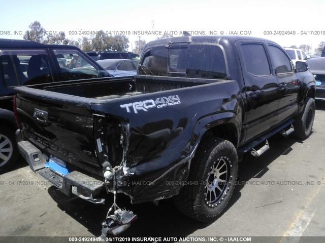 5TFCZ5ANXHX105321 - 2017 TOYOTA TACOMA DBL CAB/SR/TRDSPT/OR/PRO BLACK photo 4