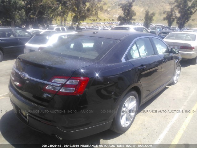 1FAHP2E85GG147513 - 2016 FORD TAURUS SEL BLACK photo 4