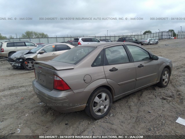 1FAFP34N85W310629 - 2005 FORD FOCUS ZX4 GOLD photo 4
