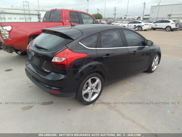 1FAHP3N20CL402958 - 2012 FORD FOCUS TITANIUM BLACK photo 4