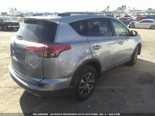 JTMRJREV3JD212026 - 2018 TOYOTA RAV4 HV LE PLUS/XLE GRAY photo 4