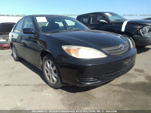 JTDBF30K120057627 - 2002 TOYOTA CAMRY LE/XLE/SE BLACK photo 1