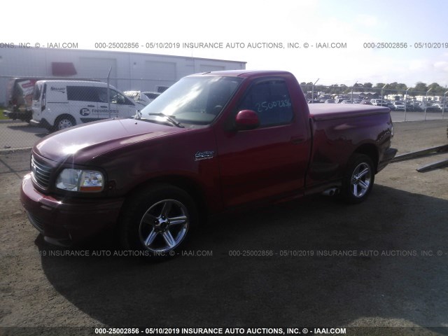 2FTRF07344CA74199 - 2004 FORD F150 SVT LIGHTNING RED photo 2