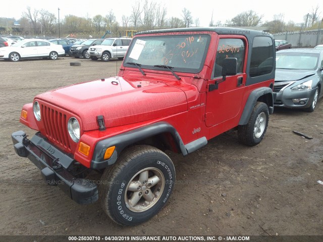 1J4FA29P3YP768099 - 2000 JEEP WRANGLER / TJ SE RED photo 2