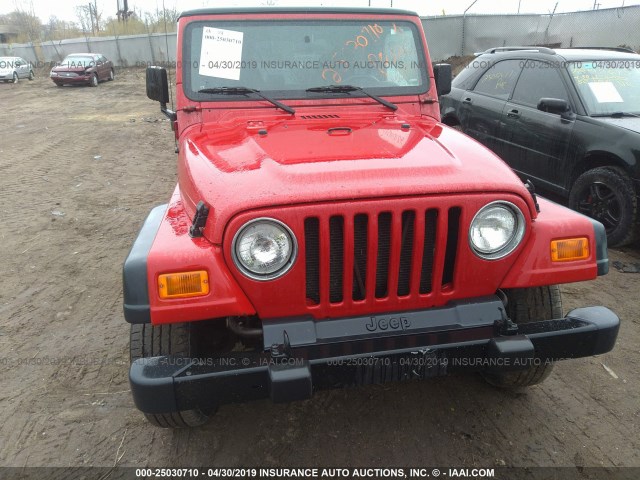 1J4FA29P3YP768099 - 2000 JEEP WRANGLER / TJ SE RED photo 6