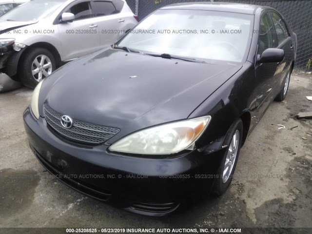 4T1BE32K42U052295 - 2002 TOYOTA CAMRY LE/XLE/SE BLACK photo 6