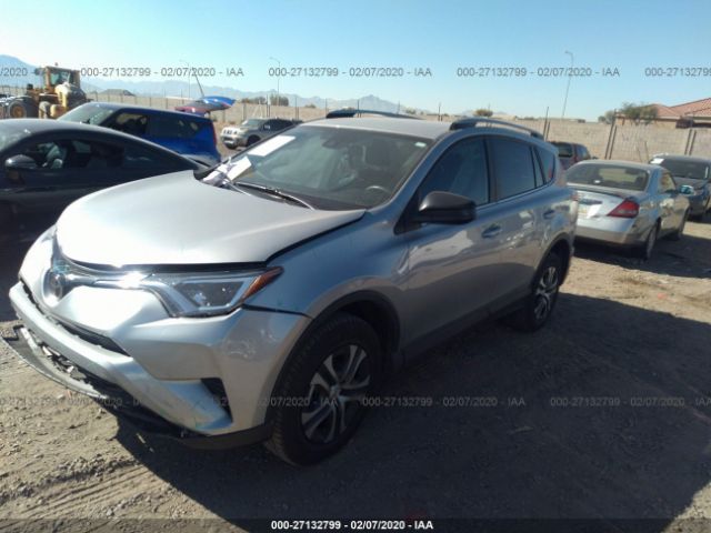 2T3ZFREV4JW515157 - 2018 TOYOTA RAV4 LE Silver photo 2