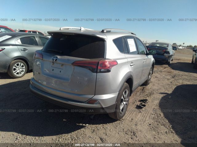 2T3ZFREV4JW515157 - 2018 TOYOTA RAV4 LE Silver photo 4